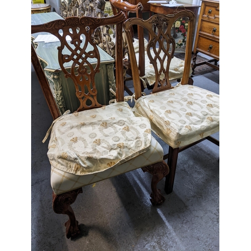 103 - A set of four Frank Hudson of High Wycombe reproduction mahogany dining chairs with upholstered over... 