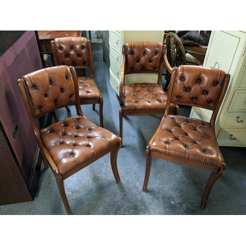 98 - A set of four Reprodux button brown leather dining chairs, one being a carver Location: GL
If there ... 