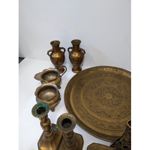 13 - A collection of metalware to include two brass kettles, two trays, a copper water jug and kettle, a ... 