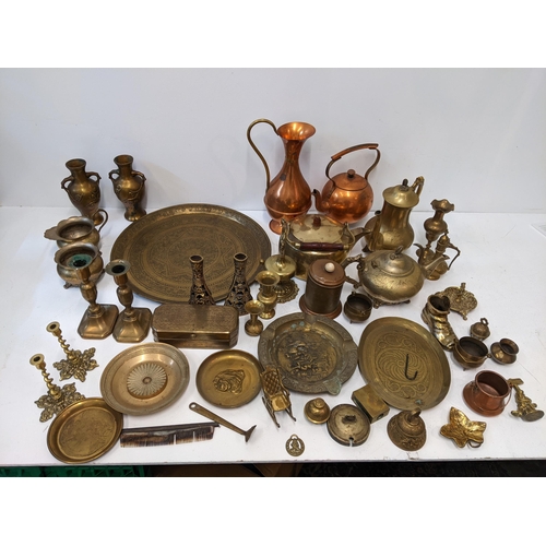 13 - A collection of metalware to include two brass kettles, two trays, a copper water jug and kettle, a ... 