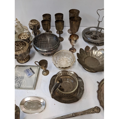 15 - A collection of silver plated items to include a ceremonial trophy tray, a bowl shaped as a flower, ... 