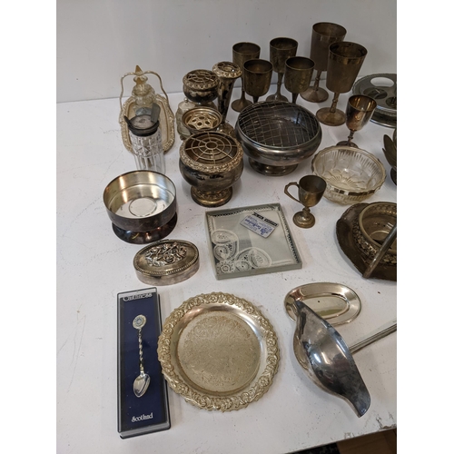 15 - A collection of silver plated items to include a ceremonial trophy tray, a bowl shaped as a flower, ... 