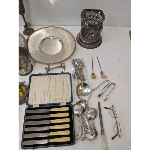 16 - A collection of silver plated items to include assorted flatware, a chalice, a wine cooler, vintage ... 