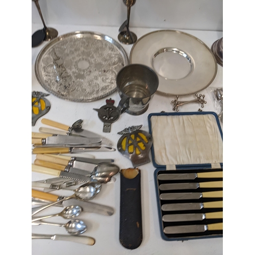 16 - A collection of silver plated items to include assorted flatware, a chalice, a wine cooler, vintage ... 