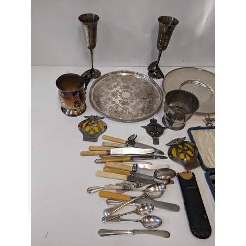 16 - A collection of silver plated items to include assorted flatware, a chalice, a wine cooler, vintage ... 