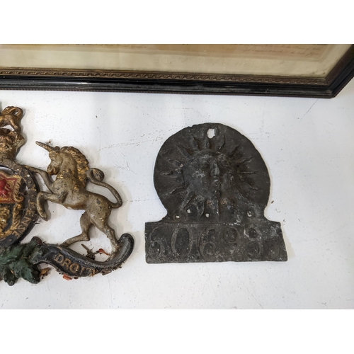 21 - Collectables to include a lead fire insurance plaque, a painted lead coat of arms and other items an... 