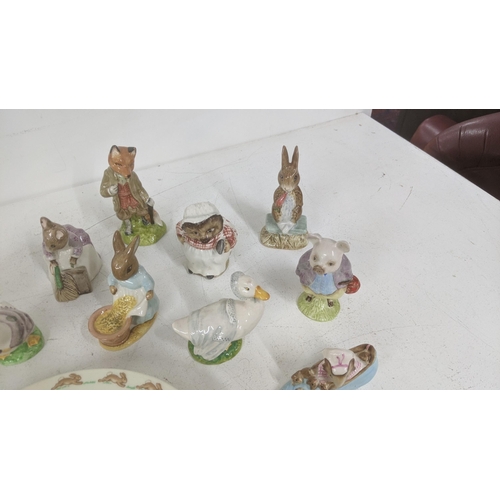 31 - A group of Beatrix Potter, Beswick and Royal Albert models to include Jemima Puddleduck, Foxy Whiske... 