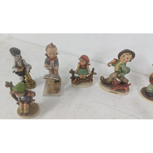 32 - Goebel - a collection of Hummel figures and figure groups to include Surprise No.94, Band Leader No.... 