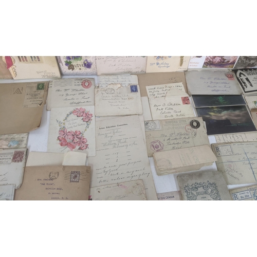 39 - A large quantity of 19th century and later ephemera to include silk postcards, handmade cards, ware ... 