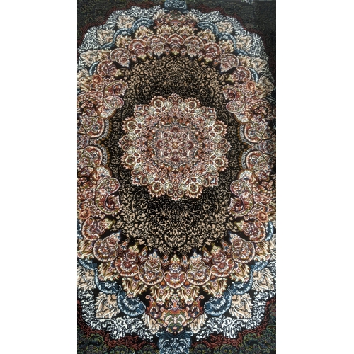 43 - A Persian machine woven rug on black ground, with repeating central motifs and tasselled ends, 150cm... 