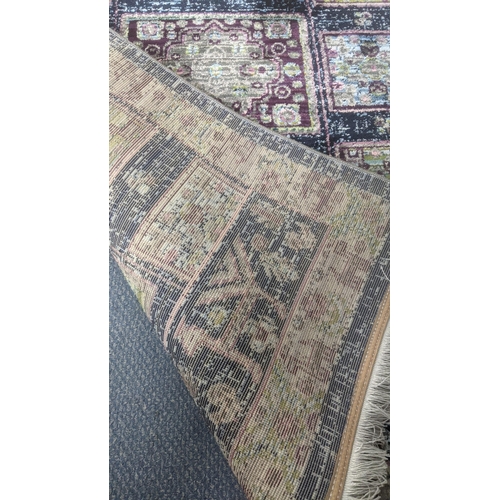 53 - A Persian machine woven rug on blue ground with a faded style geometric design, 150cm x 100cm
Locati... 