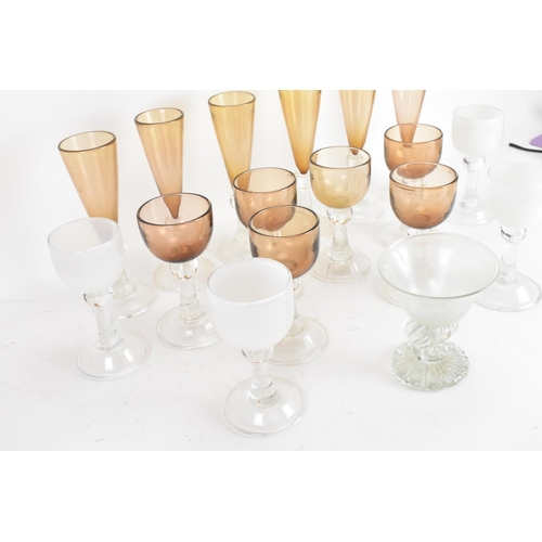 30 - Anthony Stern (1944-2022) A collection of glassware to include a hand blow iridescent shell stemmed ... 