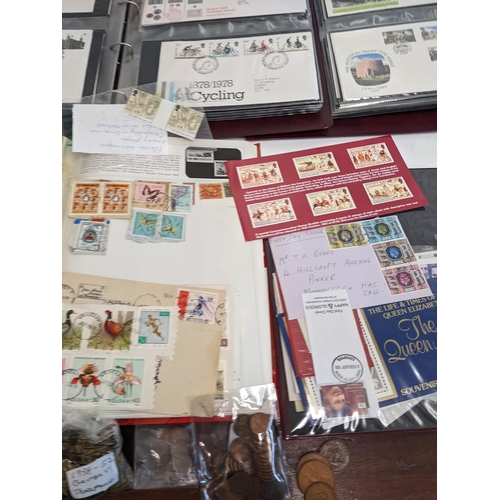 25 - Postage stamps, pre and post 1920 postcards, First Day covers, a collection of pennies, foreign coin... 