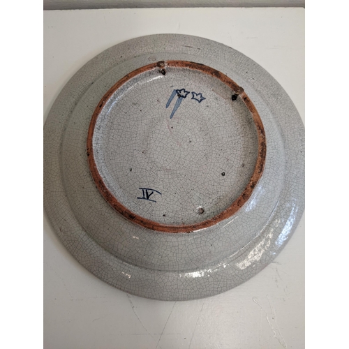 27 - A Delf style dish with a coat of arms marked A° 1722, 26.5cmw
Location: R2-4
If there is no conditio... 