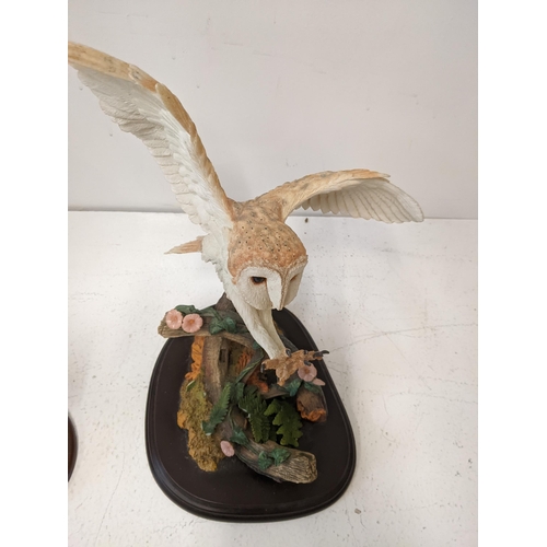 A collection of mostly owl related country artists figurines to