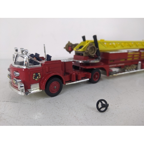 Corgi Major Toy 1143 American Lafrance Aerial Rescue Truck with a red body, yellow ladders and six f