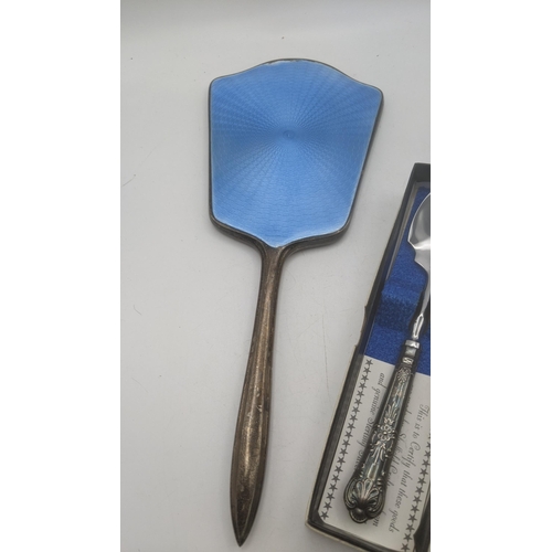 72 - A group of silver items to include a dressing table mirror with blue enamel, a silver pot, a silver ... 