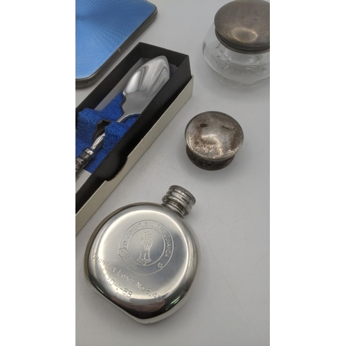 72 - A group of silver items to include a dressing table mirror with blue enamel, a silver pot, a silver ... 