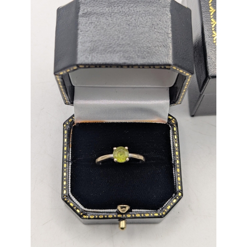 95 - A 9ct white gold and peridot in a four claw setting solitaire ring, size M1/2, 2.3g
Location: C1
If ... 