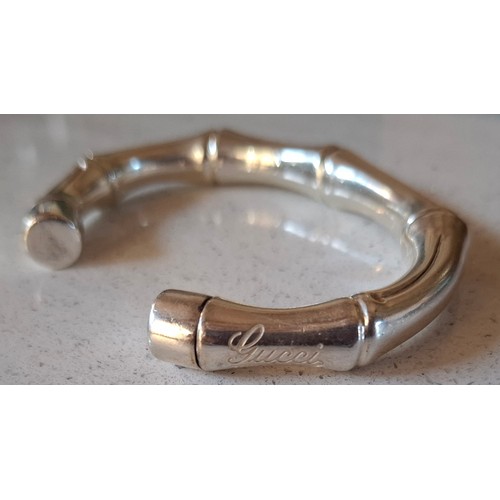Gucci- A silver bamboo open bangle, with branded pouch and