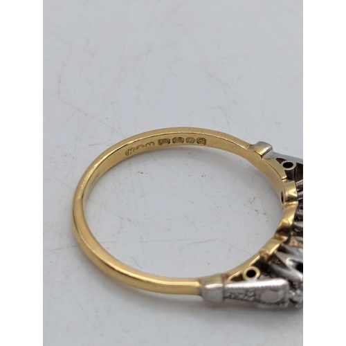 82 - An 18ct white and yellow gold three-stone diamond ring in an illusion setting, size N, 3.3g Location... 