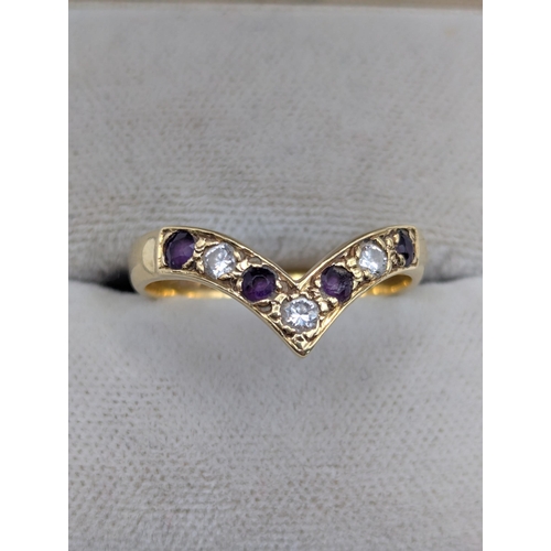 83 - Two ladies rings to include an 18ct yellow gold amethyst and diamond wishbone ring size N 1/2, toget... 