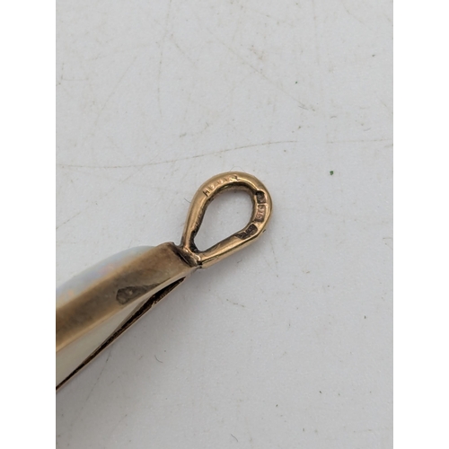 91 - An opal pendant mounted in 9ct yellow gold, total length 33.6mm x 14.6mm w
Location: C1
If there is ... 