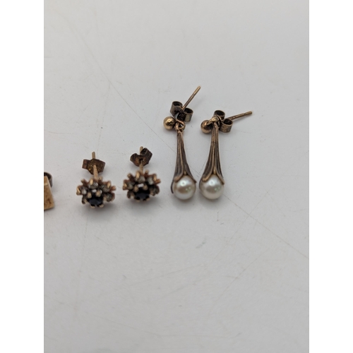 94 - A selection of gold, yellow metal to include a pair of 9ct sapphire and paste stone examples, a pair... 