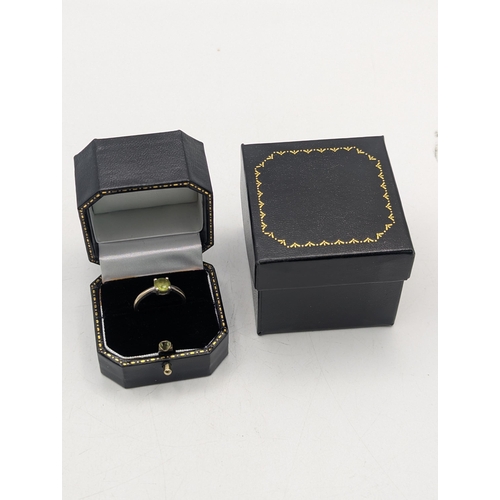 95 - A 9ct white gold and peridot in a four claw setting solitaire ring, size M1/2, 2.3g
Location: C1
If ... 