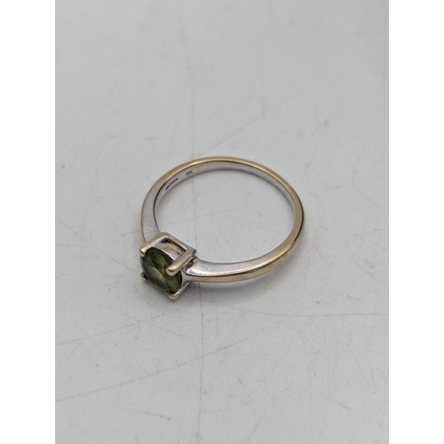 95 - A 9ct white gold and peridot in a four claw setting solitaire ring, size M1/2, 2.3g
Location: C1
If ... 