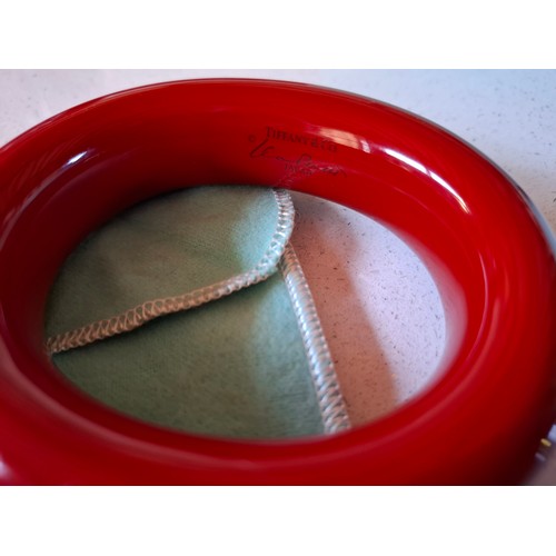 4 - Tiffany & Co- A red Elsa Peretti solid lacquered hardwood bangle with branded pouch and box, interna... 