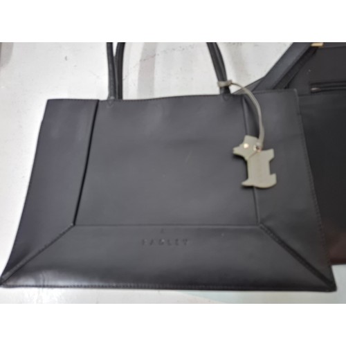 22 - Radley- Two modern black leather bags comprising a handbag with branded dust-bag and 2 detachable bl... 