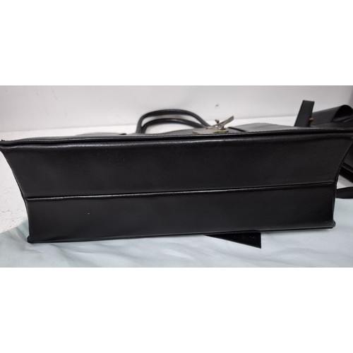 22 - Radley- Two modern black leather bags comprising a handbag with branded dust-bag and 2 detachable bl... 