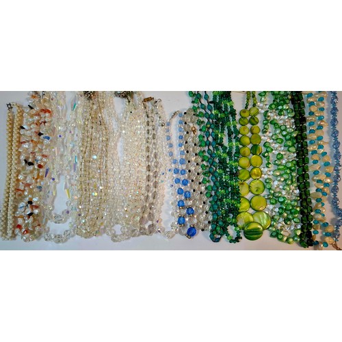 50 - A quantity of 1970's and later bead necklaces and bracelets to include Aurora Borealis necklaces, fa... 