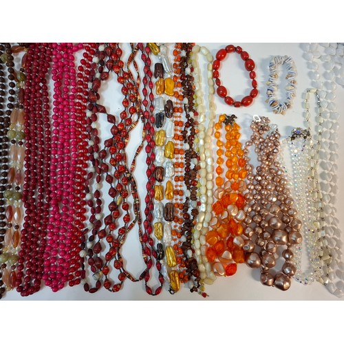 50 - A quantity of 1970's and later bead necklaces and bracelets to include Aurora Borealis necklaces, fa... 