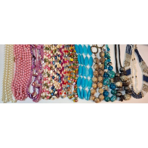 50 - A quantity of 1970's and later bead necklaces and bracelets to include Aurora Borealis necklaces, fa... 