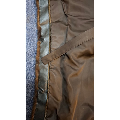 53 - A 1970's dark brown ranch mink coat with matching belt having a shawl collar and tapered waist, appr... 
