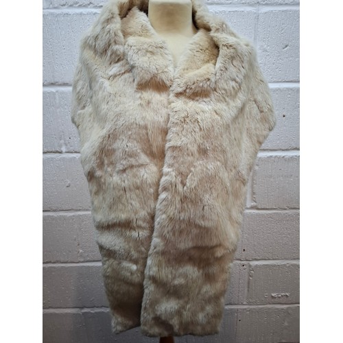 53 - A 1970's dark brown ranch mink coat with matching belt having a shawl collar and tapered waist, appr... 