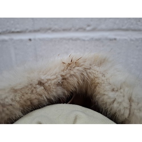 53 - A 1970's dark brown ranch mink coat with matching belt having a shawl collar and tapered waist, appr... 