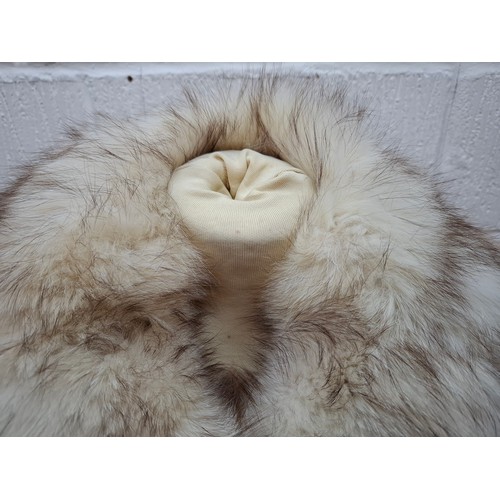 54 - A 1980's arctic fox jacket having intermittent vertical leather stripes, shawl collar and brown sati... 