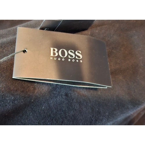 10 - Hugo Boss- A ladies unworn black full length virgin wool coat with original tags, UK16 (RRP £499). L... 