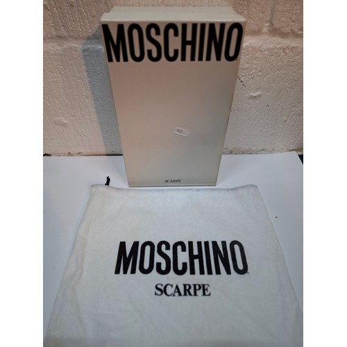16 - Moschino-A pair of Jenner Coco Turchese peep toe heeled sandals, European size 37 with branded shoe ... 