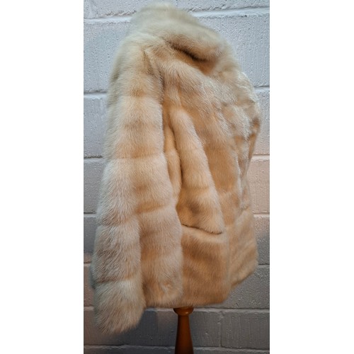 43 - A vintage arctic mink swing jacket with ¾ length flared sleeves, approx 36