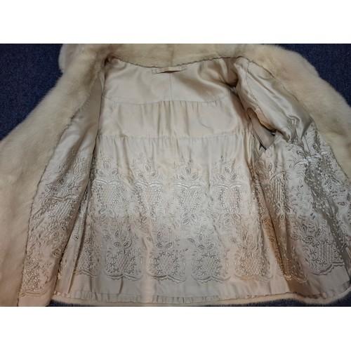 43 - A vintage arctic mink swing jacket with ¾ length flared sleeves, approx 36