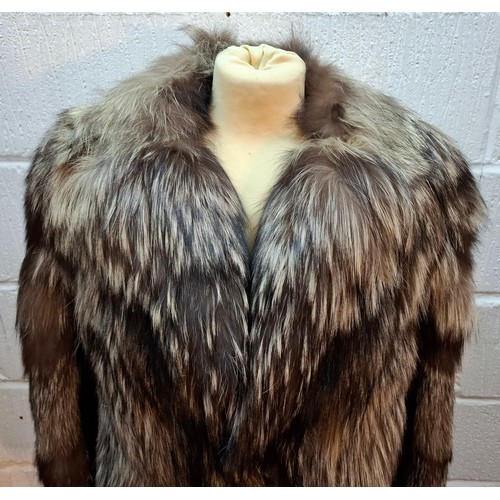 44 - A late 20th century wolf fur jacket with internal pocket embroidered with the letter 'D' and a coat ... 
