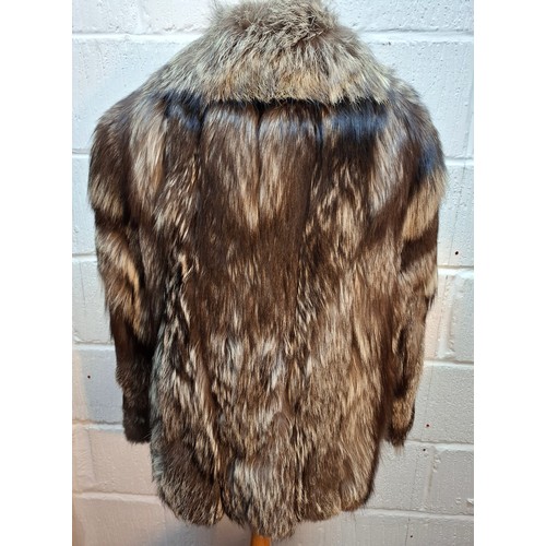 44 - A late 20th century wolf fur jacket with internal pocket embroidered with the letter 'D' and a coat ... 