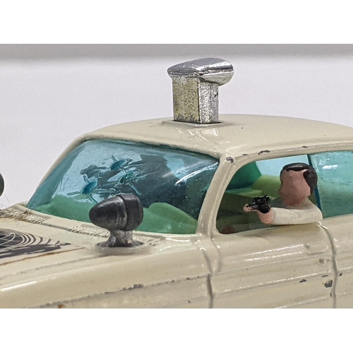 50 - Corgi Toys 497 Oldsmobile Super 88 model from The Man from UNCLE with a white body and cream interio... 