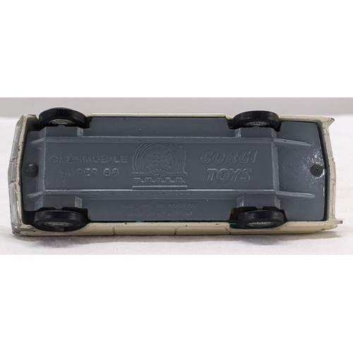 50 - Corgi Toys 497 Oldsmobile Super 88 model from The Man from UNCLE with a white body and cream interio... 