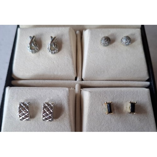 15 - Christian Dior- A pair of late 20th Century gold tone and red enamel star earrings with Dior to the ... 