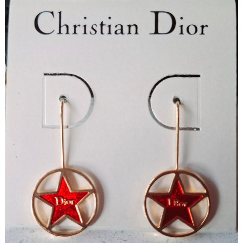 15 - Christian Dior- A pair of late 20th Century gold tone and red enamel star earrings with Dior to the ... 